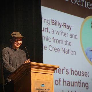 Billy-Ray Belcourt speaks at the VIU podium