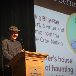 Billy-Ray Belcourt speaks at the VIU podium