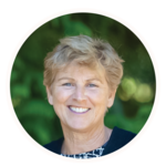 Smiling woman with short blonde hair.