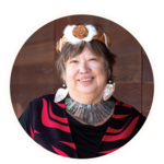Smiling woman in Coast Salish regalia