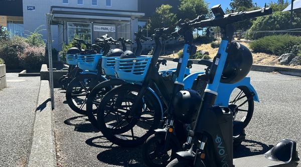 A row of electric bikes parked at VIU's Nanaimo campus