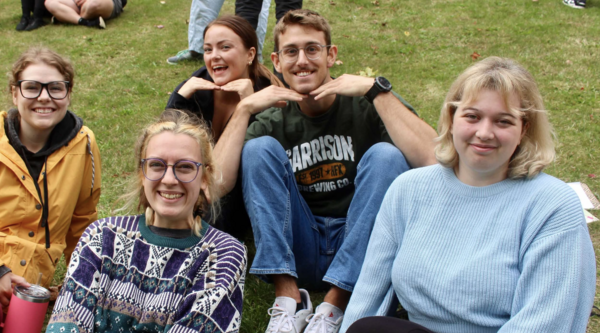 victoria dudley sitting outside with a group of her friends