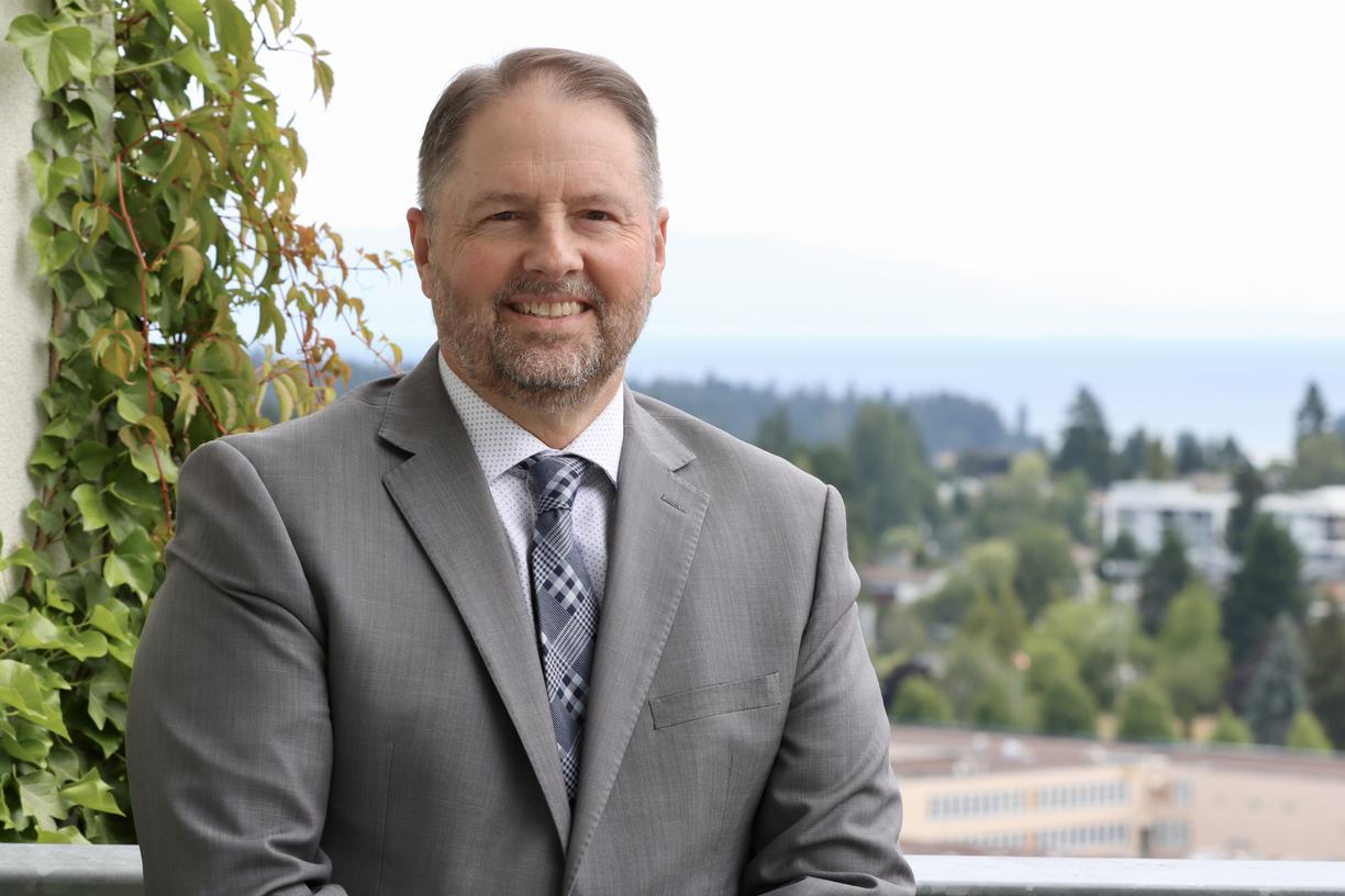 Dennis Johnson with a view of the City of Nanaimo behind him