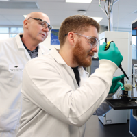 Two scientists working in a lab. 