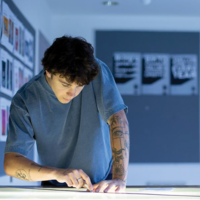Young man at work in a design studio